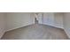 Spacious bedroom with plush carpeting, dual closets, and a neutral color scheme at 5052 Hickory Cir, Ellenwood, GA 30294
