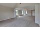 Open Primary bedroom with tray ceiling, plush carpet, columns, and large windows for plenty of natural light at 5052 Hickory Cir, Ellenwood, GA 30294