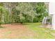 A beautiful, large backyard with mature trees at 5312 Brittany Trl, Atlanta, GA 30349