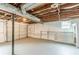 Unfinished basement with garage door and built-in shelving at 5312 Brittany Trl, Atlanta, GA 30349