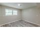 A basement space with new flooring and natural light showcases an adaptable area at 5312 Brittany Trl, Atlanta, GA 30349