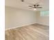 A finished basement area features updated flooring, neutral walls, and a ceiling fan at 5312 Brittany Trl, Atlanta, GA 30349