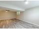 This spacious basement has a ceiling fan, and updated flooring and receives natural light at 5312 Brittany Trl, Atlanta, GA 30349