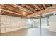 Unfinished basement with overhead utilities, shelving, and painted walls at 5312 Brittany Trl, Atlanta, GA 30349