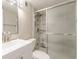 A bright bathroom with marble-look tiles and a glass shower at 5312 Brittany Trl, Atlanta, GA 30349