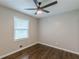 Bedroom featuring a ceiling fan, window, and hardwood flooring at 5312 Brittany Trl, Atlanta, GA 30349