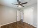 Bedroom view showcasing a ceiling fan, closet, and hardwood flooring at 5312 Brittany Trl, Atlanta, GA 30349