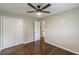This bedroom has hardwood floors, double closets, and a ceiling fan at 5312 Brittany Trl, Atlanta, GA 30349