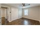 Bedroom features a ceiling fan, hardwood floors, and closet at 5312 Brittany Trl, Atlanta, GA 30349