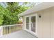 The home's deck boasts glass patio doors and gray wood flooring at 5312 Brittany Trl, Atlanta, GA 30349