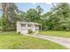 Charming two-story home with manicured lawn, driveway, and attached garage at 5312 Brittany Trl, Atlanta, GA 30349