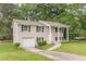 Inviting two-story home with brick accents, covered entryway, and attached garage at 5312 Brittany Trl, Atlanta, GA 30349