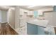 Remodeled kitchen features white cabinets, sleek marble countertops, and stainless steel sink at 5312 Brittany Trl, Atlanta, GA 30349