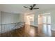 Open floor plan with hardwood floors and natural light leading to the kitchen and outdoor access at 5312 Brittany Trl, Atlanta, GA 30349