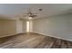 A modern living room featuring durable flooring, a ceiling fan, and neutral paint at 5312 Brittany Trl, Atlanta, GA 30349