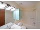 Bright bathroom featuring a tub-shower combo, white vanity, and coordinated mint medicine cabinet at 999 Wiley Bridge Rd, Woodstock, GA 30188