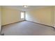 Spacious bedroom with neutral carpet, natural light from a window and ample space for furniture at 999 Wiley Bridge Rd, Woodstock, GA 30188