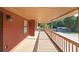 A wood deck with white railings, outdoor lighting, and nice wood trim at 999 Wiley Bridge Rd, Woodstock, GA 30188