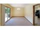 Open dining room area with sliding glass doors to the deck and a view of the kitchen at 999 Wiley Bridge Rd, Woodstock, GA 30188