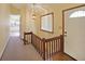 Inviting entryway featuring hardwood floors, a staircase, and a view of the kitchen at 999 Wiley Bridge Rd, Woodstock, GA 30188