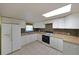 Functional kitchen featuring white appliances, tile floors, and ample counter space at 999 Wiley Bridge Rd, Woodstock, GA 30188