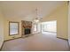 Bright living room with a stone fireplace, vaulted ceilings, and sliding glass doors at 999 Wiley Bridge Rd, Woodstock, GA 30188