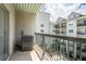 Comfortable balcony with railings overlooking other buildings and a community pool at 1074 Peachtree Ne Walk # B404, Atlanta, GA 30309