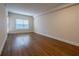 Bright bedroom featuring laminate flooring, neutral walls, and natural light from the window at 1074 Peachtree Ne Walk # B404, Atlanta, GA 30309