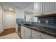 Kitchen featuring stainless steel dishwasher, sink, and dark countertops at 1074 Peachtree Ne Walk # B404, Atlanta, GA 30309