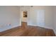 Bright living room with hardwood floors, closet and doorway to kitchen area at 1074 Peachtree Ne Walk # B404, Atlanta, GA 30309