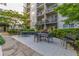 Relaxing outdoor area with tables, chairs, and well-maintained landscaping at 1074 Peachtree Ne Walk # B404, Atlanta, GA 30309