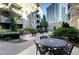 Beautiful outdoor courtyard with tables and chairs, perfect for relaxing or socializing at 1074 Peachtree Ne Walk # B404, Atlanta, GA 30309