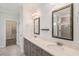Elegant bathroom features a double vanity, framed mirrors, and tiled shower at 122 Gingers Way, Mcdonough, GA 30252