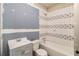 Bathroom featuring tiled shower and tub, along with a stylish vanity; ready for final touches at 122 Gingers Way, Mcdonough, GA 30252