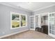 Bright room with carpeted floors, natural light, and glass French doors at 122 Gingers Way, Mcdonough, GA 30252