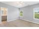 Serene bedroom with plush carpeting, view to the backyard and ensuite bathroom at 122 Gingers Way, Mcdonough, GA 30252