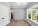 Bedroom with large windows and easy access to ensuite bathroom at 122 Gingers Way, Mcdonough, GA 30252