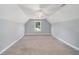 Spacious carpeted bonus room features a ceiling fan and a window at 122 Gingers Way, Mcdonough, GA 30252