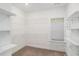 Walk-in closet with shelving for ample storage space at 122 Gingers Way, Mcdonough, GA 30252