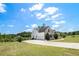 Spacious home with an attached two-car garage, a long driveway, and a well-maintained lawn at 122 Gingers Way, Mcdonough, GA 30252