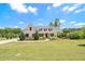 Beautiful house with a lush green lawn, elegant landscaping, and a circular driveway at 122 Gingers Way, Mcdonough, GA 30252