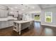 Gourmet kitchen with gray cabinets, granite countertops, and a large center island at 122 Gingers Way, Mcdonough, GA 30252