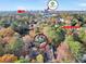 Aerial view of the home with skyline views, lush landscaping, and close proximity to North Druid Hills Road at 1482 N Crossing Ne Cir, Atlanta, GA 30329