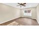 Bedroom features include a ceiling fan, window with shutters, and wood flooring at 1482 N Crossing Ne Cir, Atlanta, GA 30329