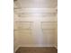 The closet is designed with metal shelving and wood floors at 1482 N Crossing Ne Cir, Atlanta, GA 30329