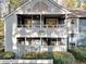 Charming two-story townhome featuring a balcony and well-maintained landscaping at 1482 N Crossing Ne Cir, Atlanta, GA 30329