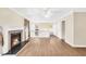 Cozy living room featuring a fireplace, wood floors, and bright windows at 1482 N Crossing Ne Cir, Atlanta, GA 30329