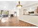 Bright living room featuring wood floors, a fireplace, and sliding glass doors leading to a balcony at 1482 N Crossing Ne Cir, Atlanta, GA 30329