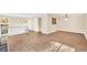 Well-lit living area boasting modern flooring, neutral walls, and a view of the staircase at 1482 N Crossing Ne Cir, Atlanta, GA 30329
