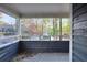 Cozy porch with wood floors and trim offers serene neighborhood views through framed openings at 1482 N Crossing Ne Cir, Atlanta, GA 30329
